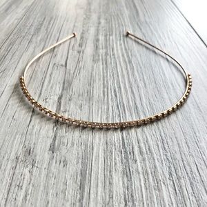 Rhinestone encrusted gold colored head band